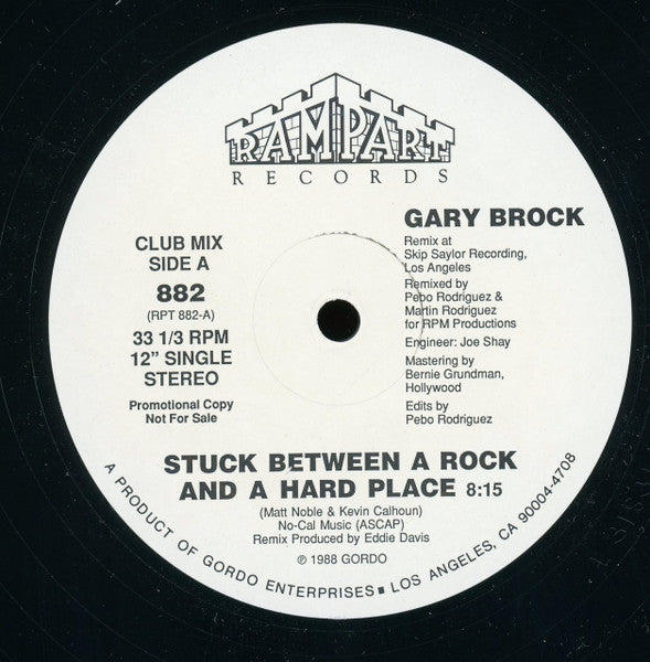 Gary Brock : Stuck Between A Rock And A Hard Place (12", Single, Promo)