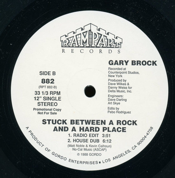 Gary Brock : Stuck Between A Rock And A Hard Place (12", Single, Promo)